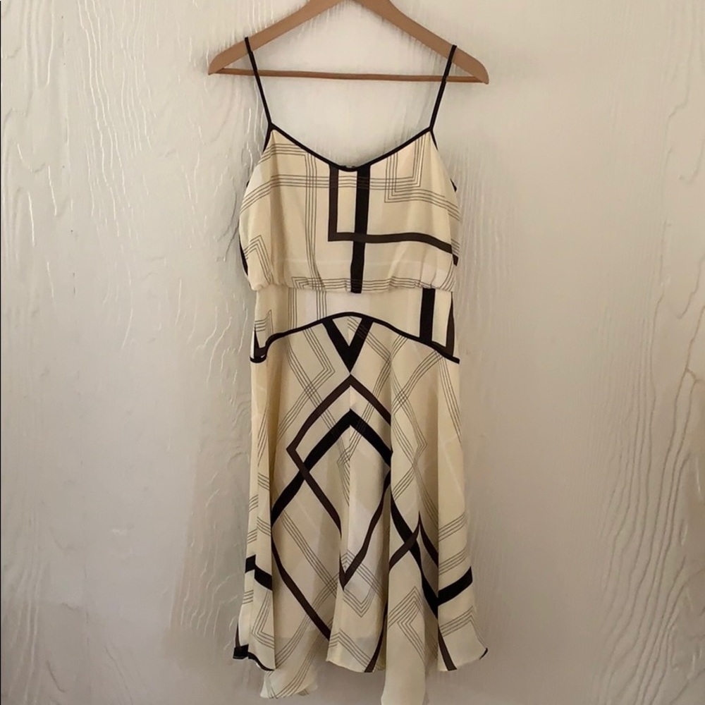 Spaghetti strap dress in cream and black.